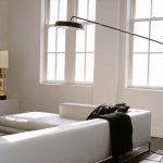 Bright living room with designer floor lamp